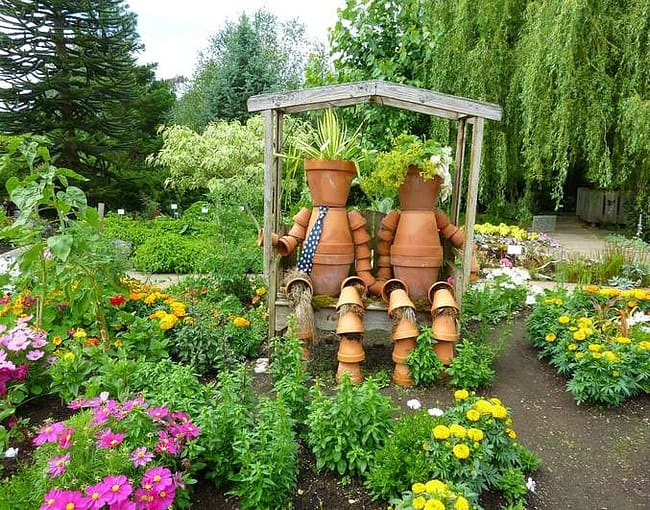 garden sculpture made from planting pots