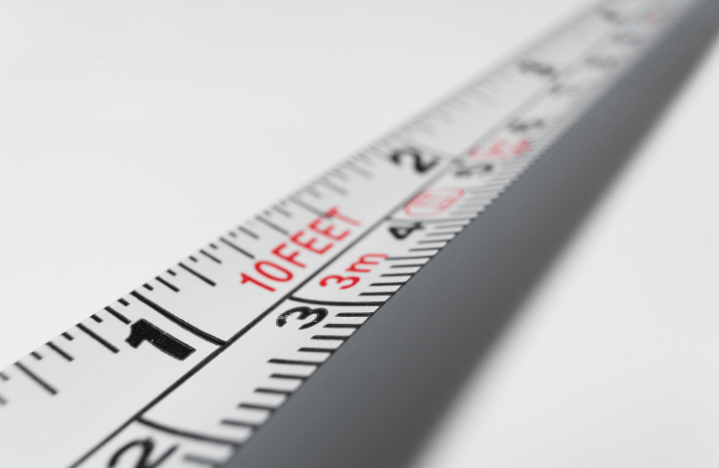 measuring tape on a gray background